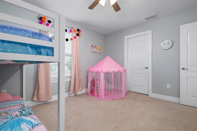 carpeted bedroom featuring ceiling fan