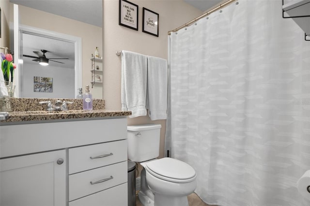 bathroom with vanity, toilet, and ceiling fan