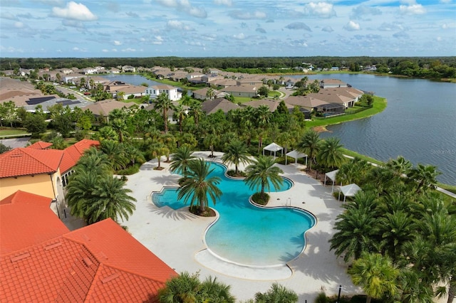 birds eye view of property with a water view