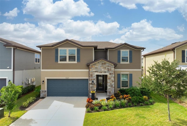 view of front of property featuring a front yard and a garage