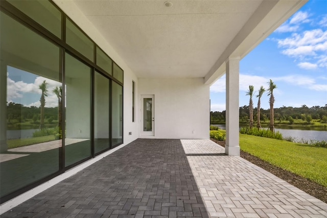 view of patio / terrace featuring a water view