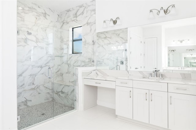 bathroom featuring vanity and a shower with shower door