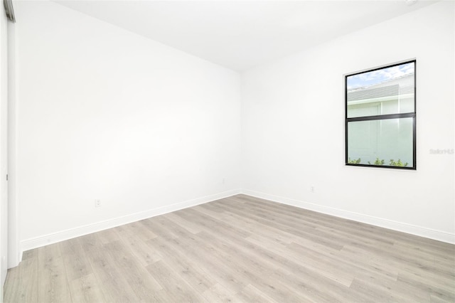 empty room with light hardwood / wood-style floors