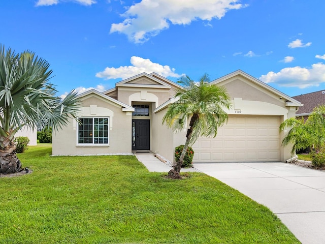 view of front facade featuring a front lawn and a garage