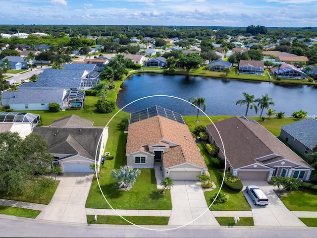 birds eye view of property with a water view