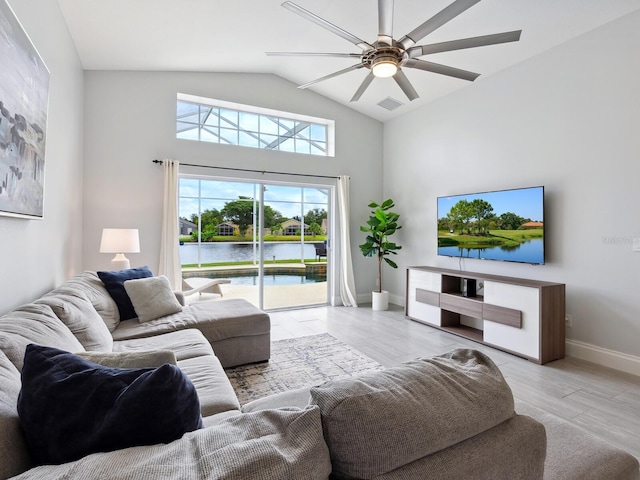 living room with light hardwood / wood-style flooring, lofted ceiling, and ceiling fan