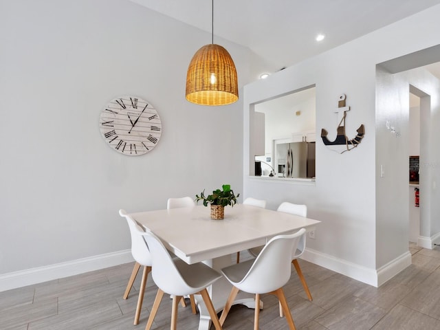 dining space with light wood-type flooring