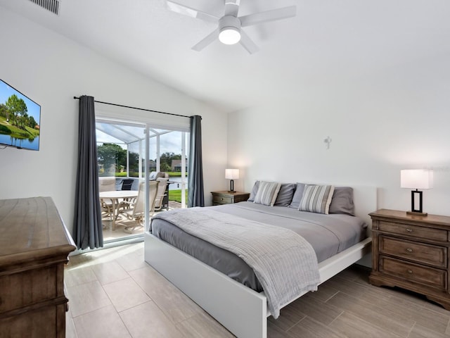 bedroom featuring access to outside, lofted ceiling, and ceiling fan