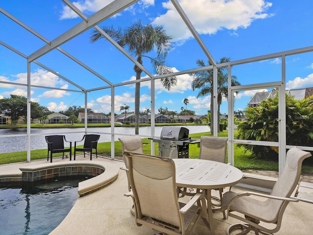 sunroom / solarium featuring a water view