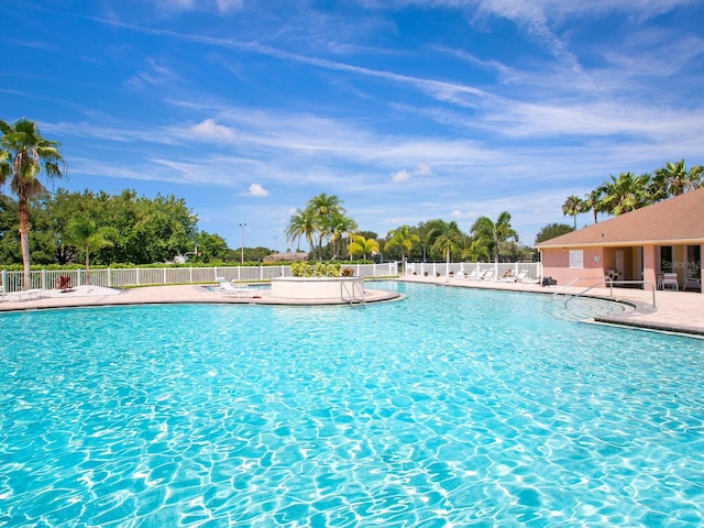 view of swimming pool featuring a patio area