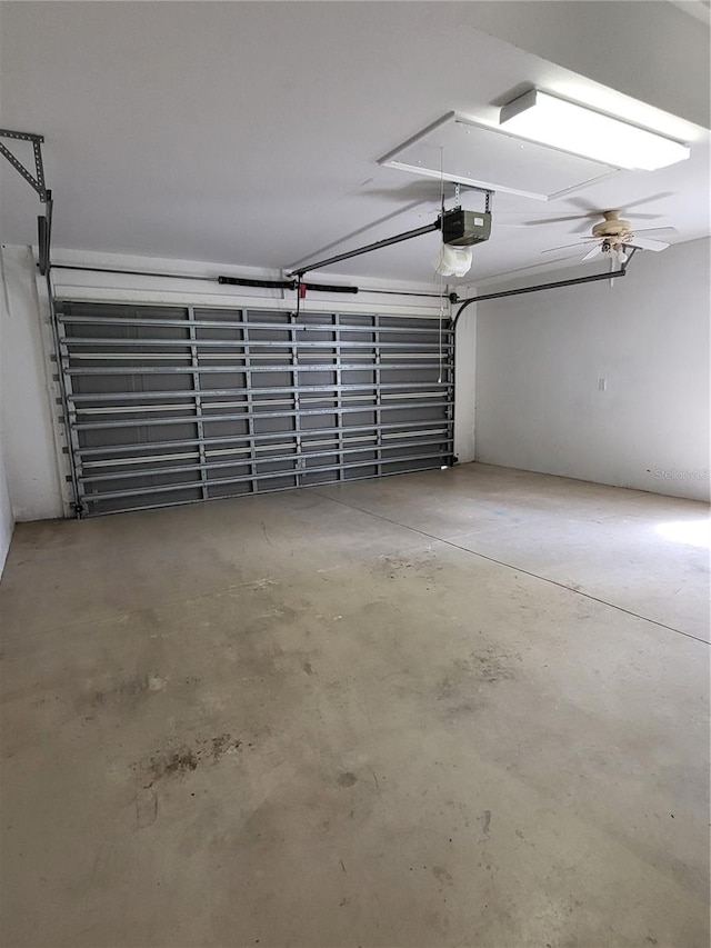 garage featuring ceiling fan and a garage door opener