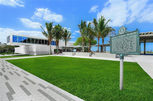 exterior space featuring a water view and a yard