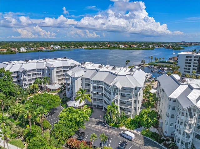 birds eye view of property with a water view