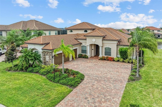 mediterranean / spanish-style home with a front yard