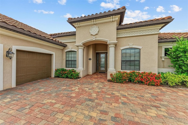 mediterranean / spanish-style house featuring a garage