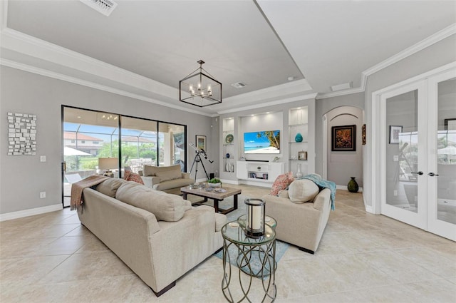 living room with crown molding, an inviting chandelier, light tile patterned floors, and french doors