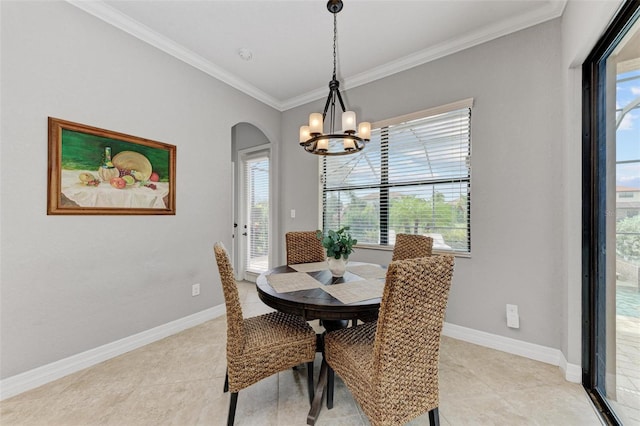 dining room featuring a notable chandelier, plenty of natural light, light tile patterned floors, and crown molding