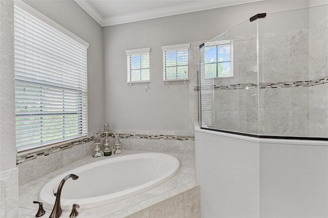 bathroom featuring crown molding and separate shower and tub