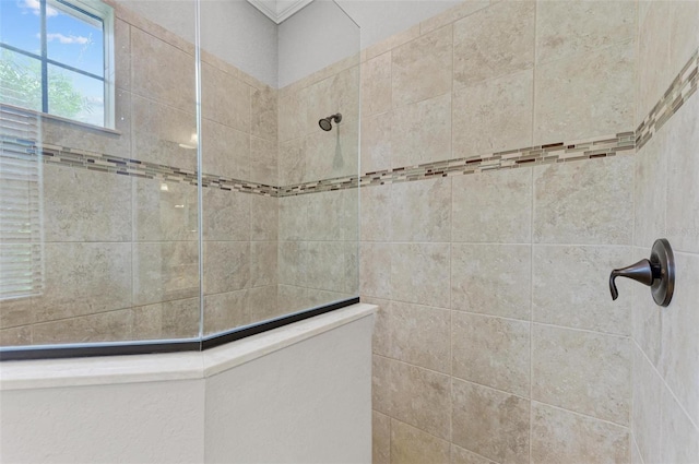 bathroom with a tile shower