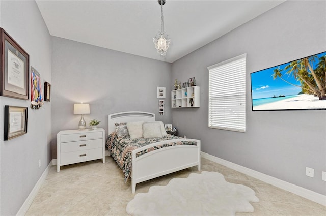 bedroom featuring an inviting chandelier