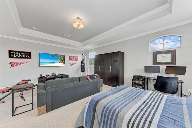 carpeted bedroom with a tray ceiling and crown molding