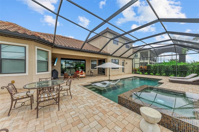 view of swimming pool featuring a patio, glass enclosure, and an in ground hot tub