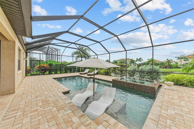 view of swimming pool with a lanai, an in ground hot tub, and a patio area