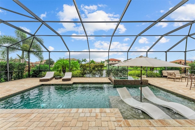 view of swimming pool featuring a lanai, a patio, and an in ground hot tub