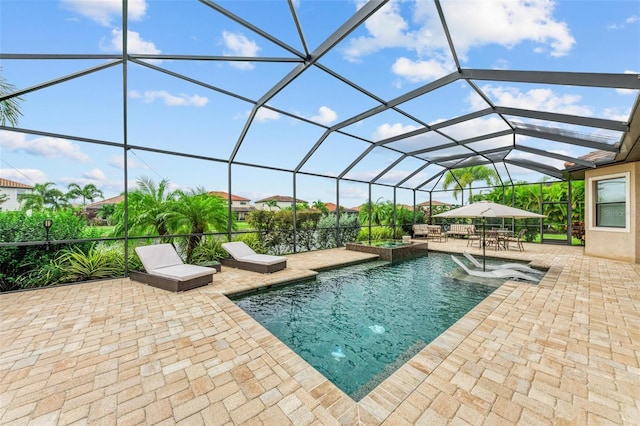 view of pool featuring a lanai and a patio area