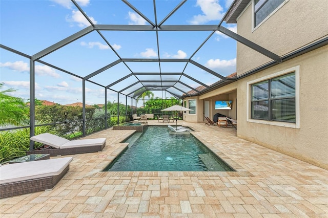 view of swimming pool with a patio and glass enclosure