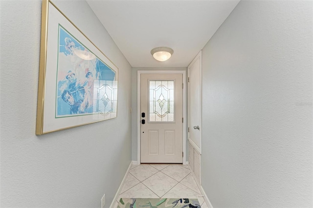 entryway featuring light tile patterned flooring