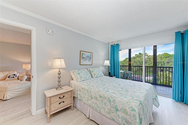 bedroom featuring access to outside, light wood-type flooring, and crown molding