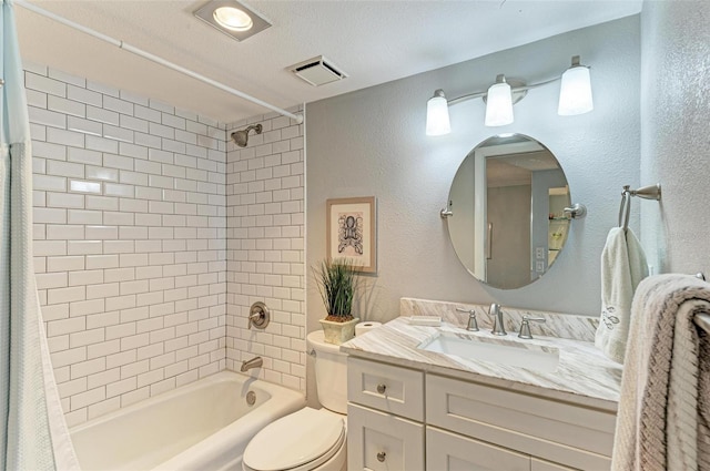 full bathroom featuring vanity, shower / tub combo, a textured ceiling, and toilet