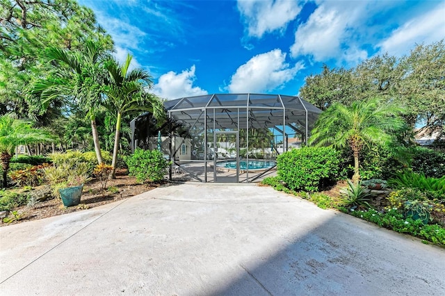 view of patio / terrace with a lanai