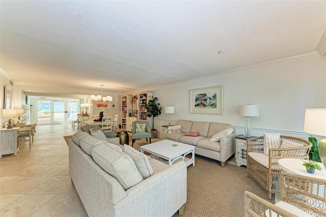 living room featuring crown molding, a textured ceiling, light tile patterned flooring, and an inviting chandelier