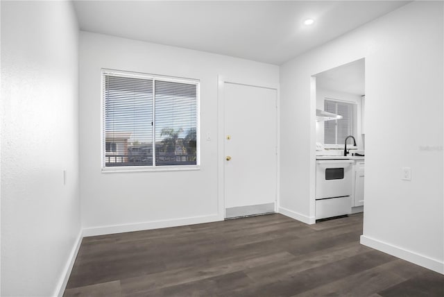 interior space with dark hardwood / wood-style flooring