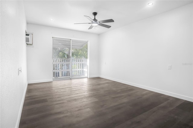 empty room featuring ceiling fan, dark hardwood / wood-style flooring, and an AC wall unit