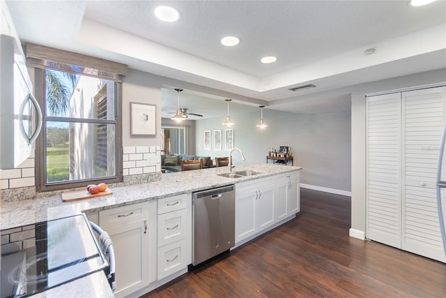 kitchen featuring decorative backsplash, stainless steel appliances, white cabinetry, and sink