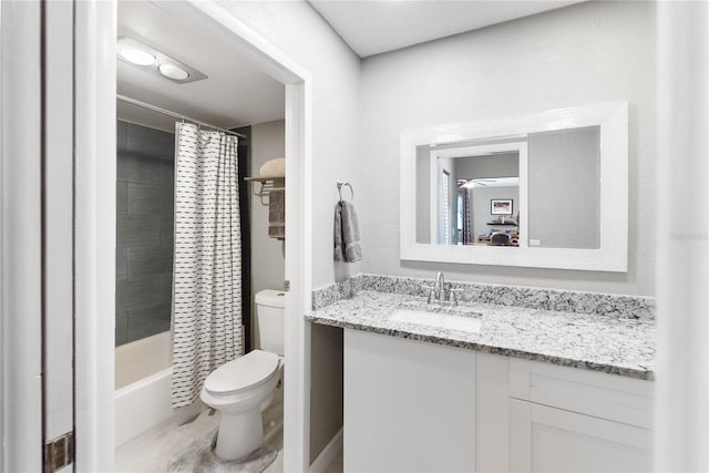 full bathroom with ceiling fan, shower / bath combination with curtain, vanity, and toilet