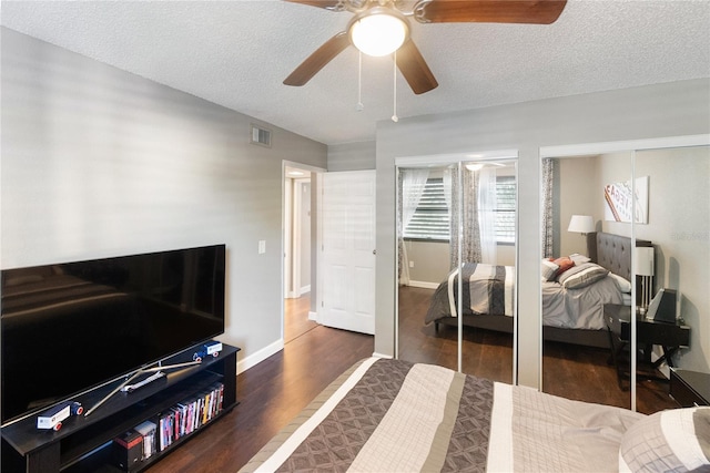 bedroom with ceiling fan, a textured ceiling, a closet, and dark hardwood / wood-style flooring