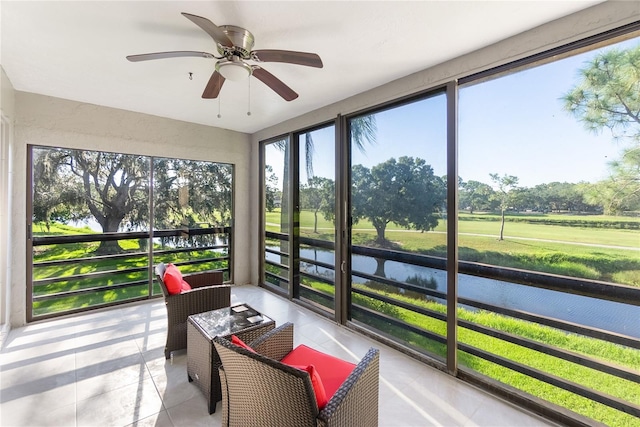 sunroom / solarium featuring ceiling fan