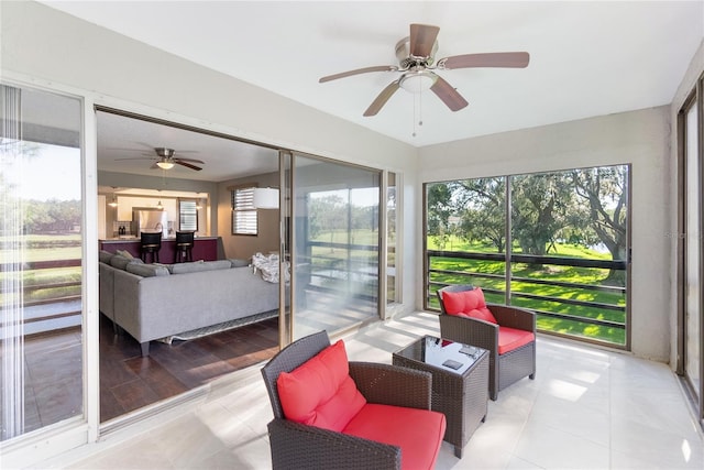 sunroom / solarium with ceiling fan