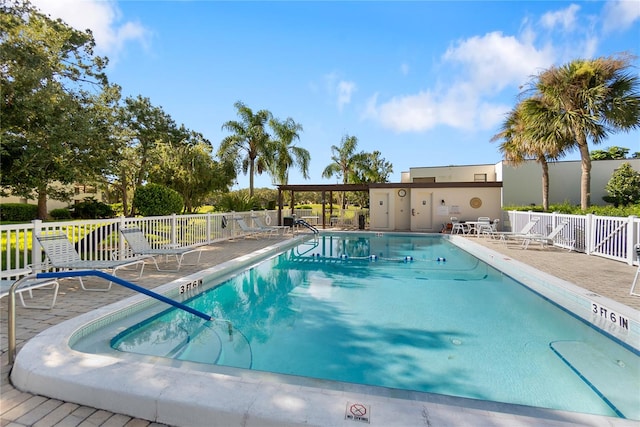 view of swimming pool with a patio