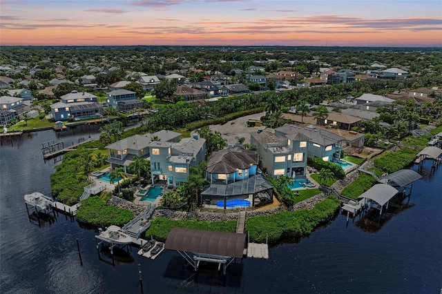 aerial view at dusk with a water view