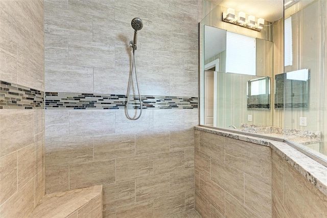 bathroom featuring tiled shower