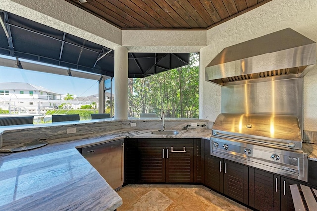 kitchen featuring light stone countertops, dark brown cabinets, dishwasher, and sink