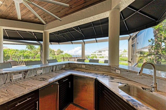 view of patio / terrace with a gazebo and sink