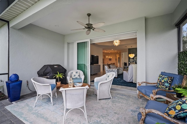 view of patio featuring area for grilling and ceiling fan