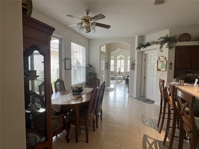 dining room with ceiling fan and light tile patterned flooring