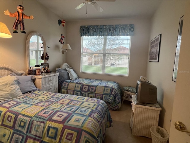 bedroom featuring ceiling fan, lofted ceiling, and carpet flooring